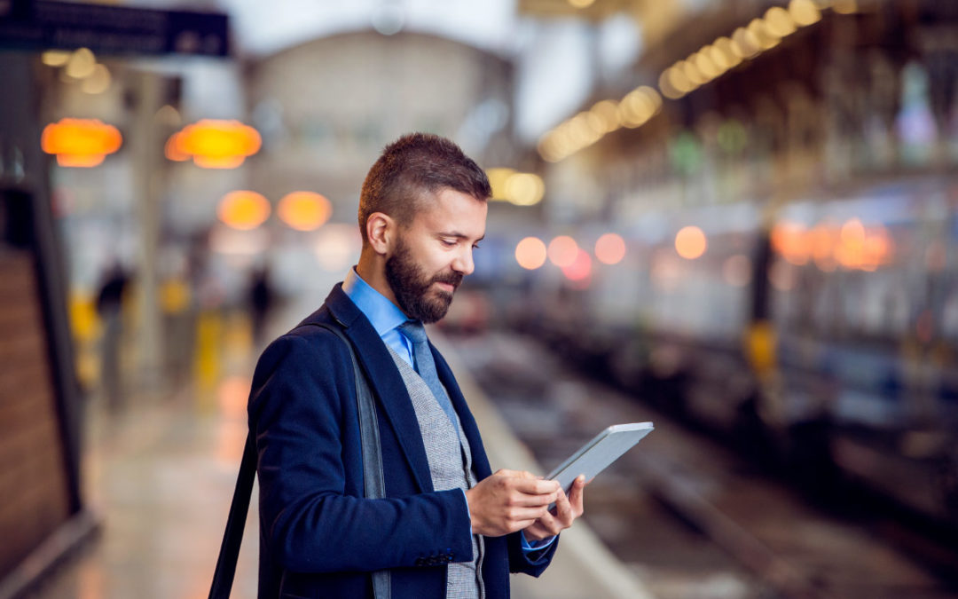 man looking at an ipad