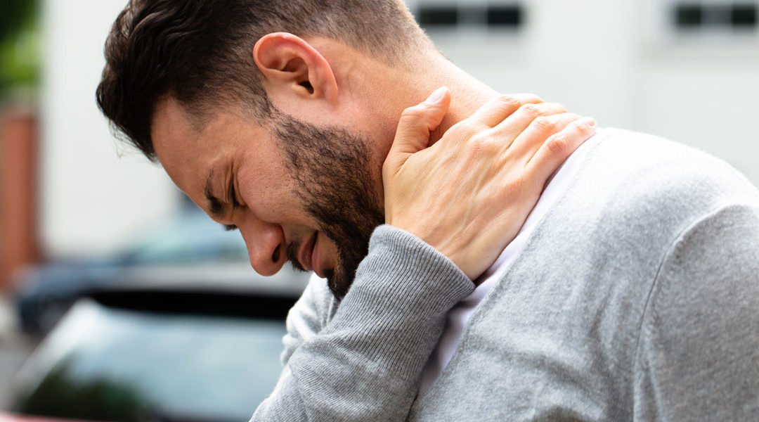 a man suffering a neck sprain